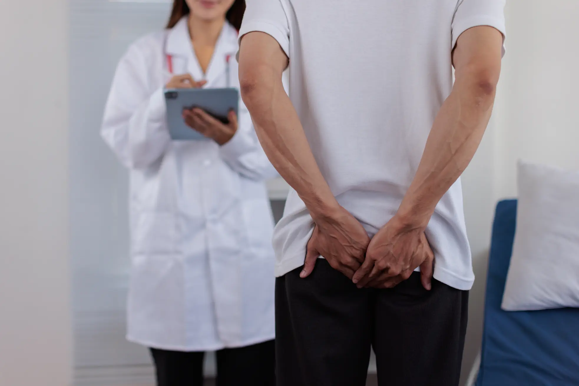 Patient consulting anal fistula specialist for pain symptoms